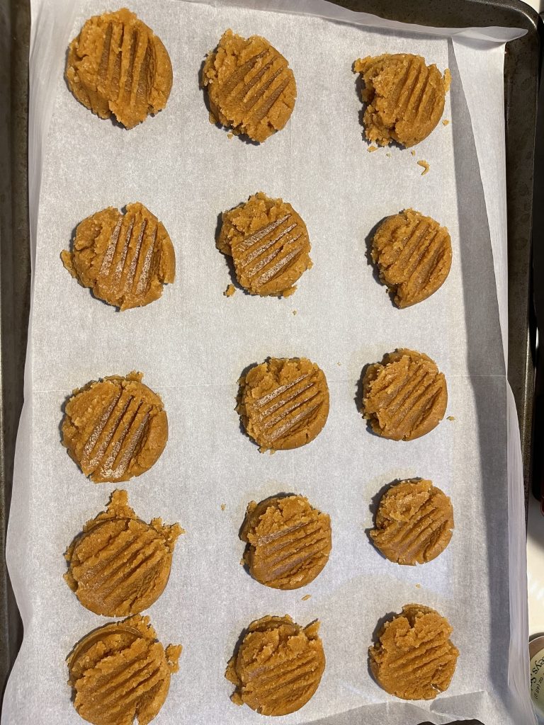 peanut butter cookie dough on a sheet, ready to bake
